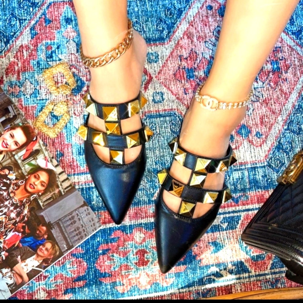 Black flat sandals with studded gold